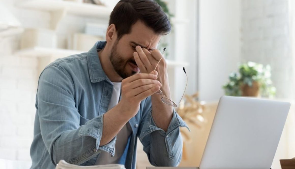 Person-feeling-tired-and-fatigued-at-work showing vitamin d deficiency symptoms