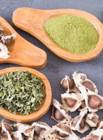 Best Moringa supplement: Moringa oleifera tree with green leaves and pods.