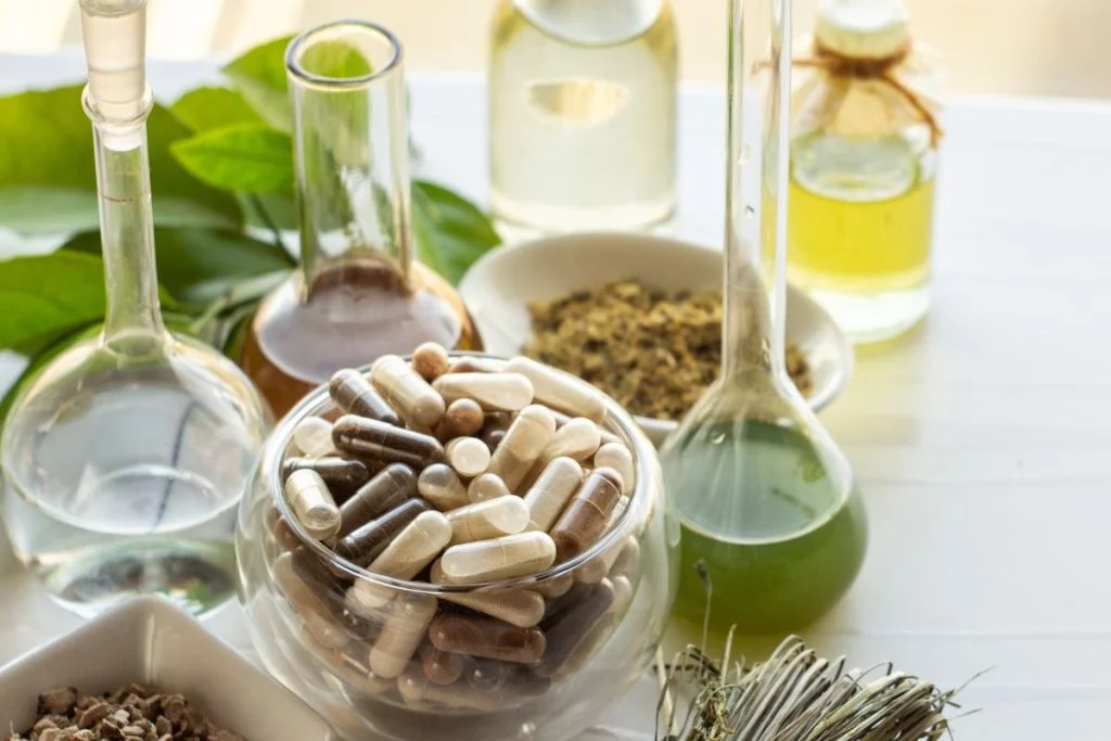 mushroom supplements in different forms on a table- benefits of mushrooms